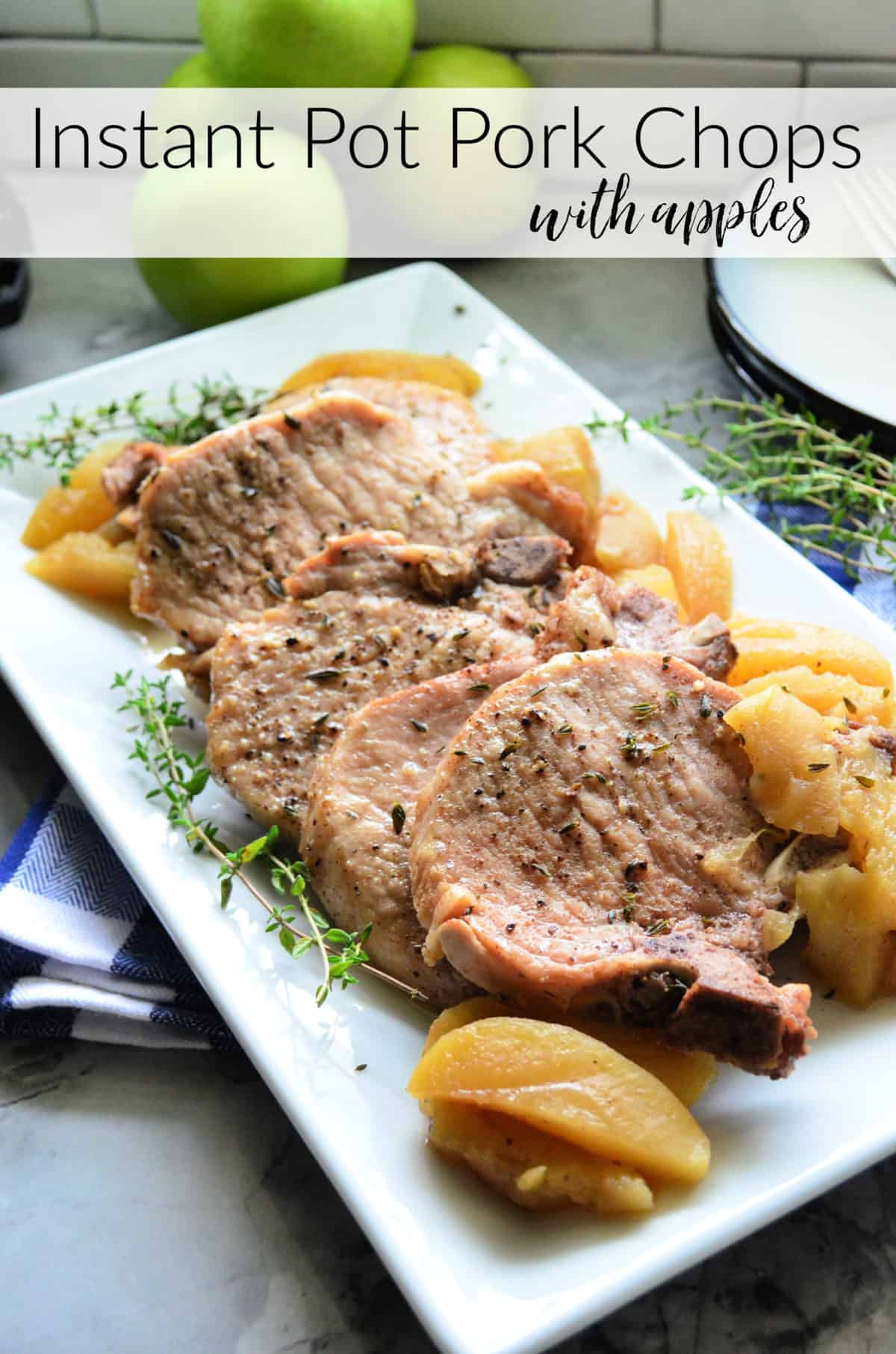 Platter of sliced pork chops with thyme and apples and title text.