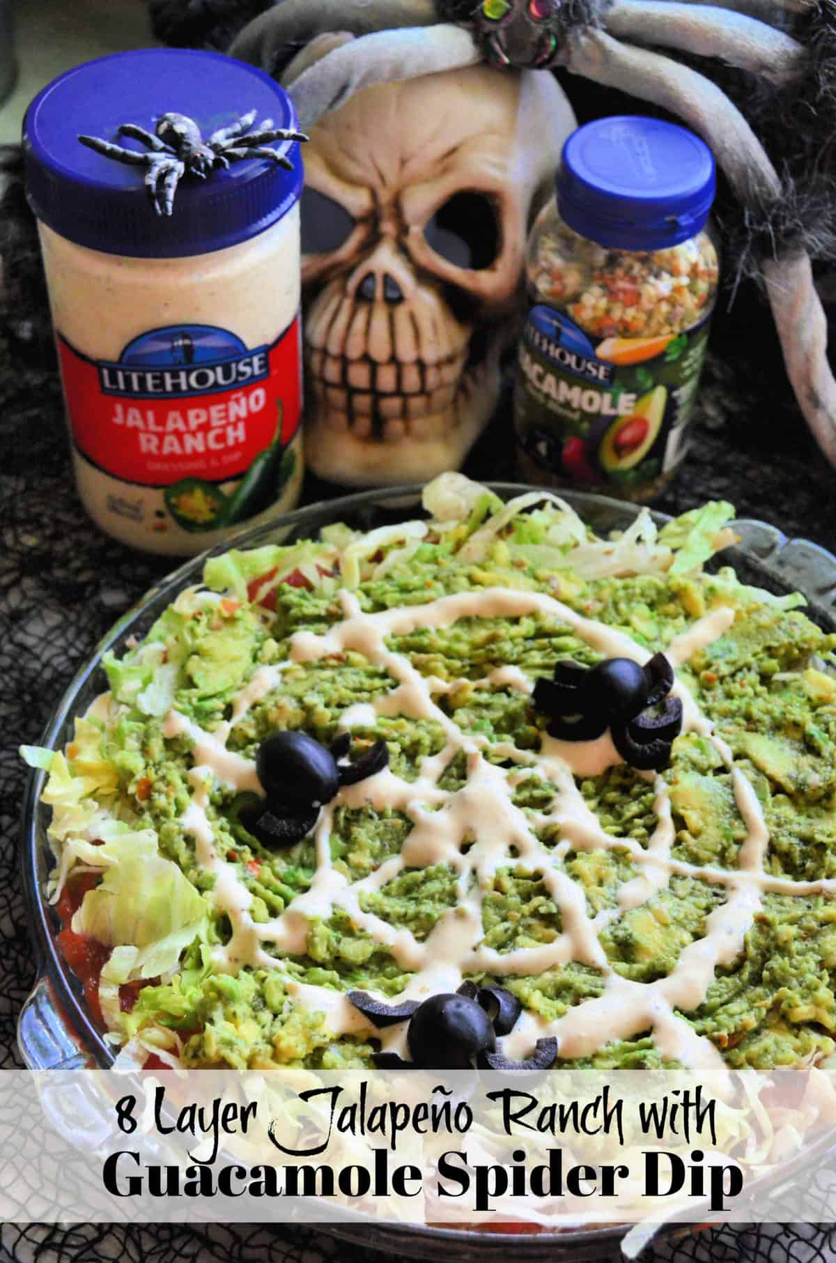 green dip with ranch to look like web, olives cut into spiders, and title text.