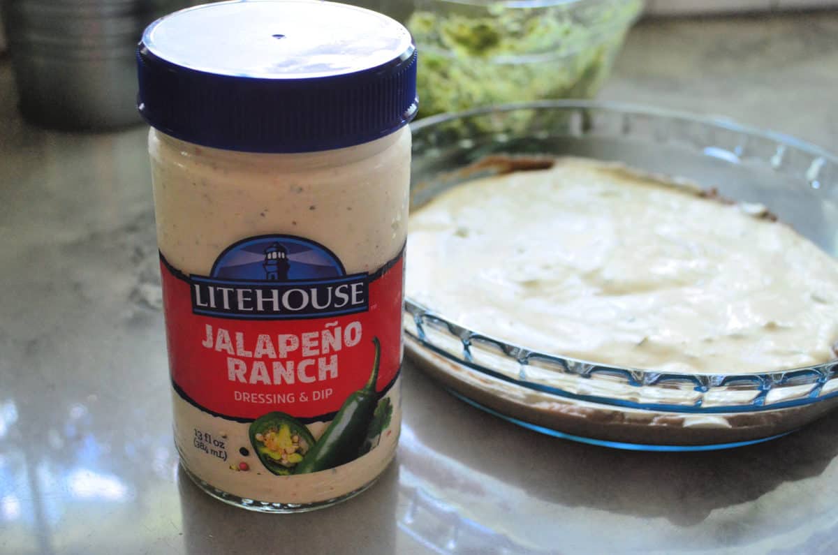 jar of Litehouse Jalapeno Ranch in front of casserole dish with the ranch for the base.