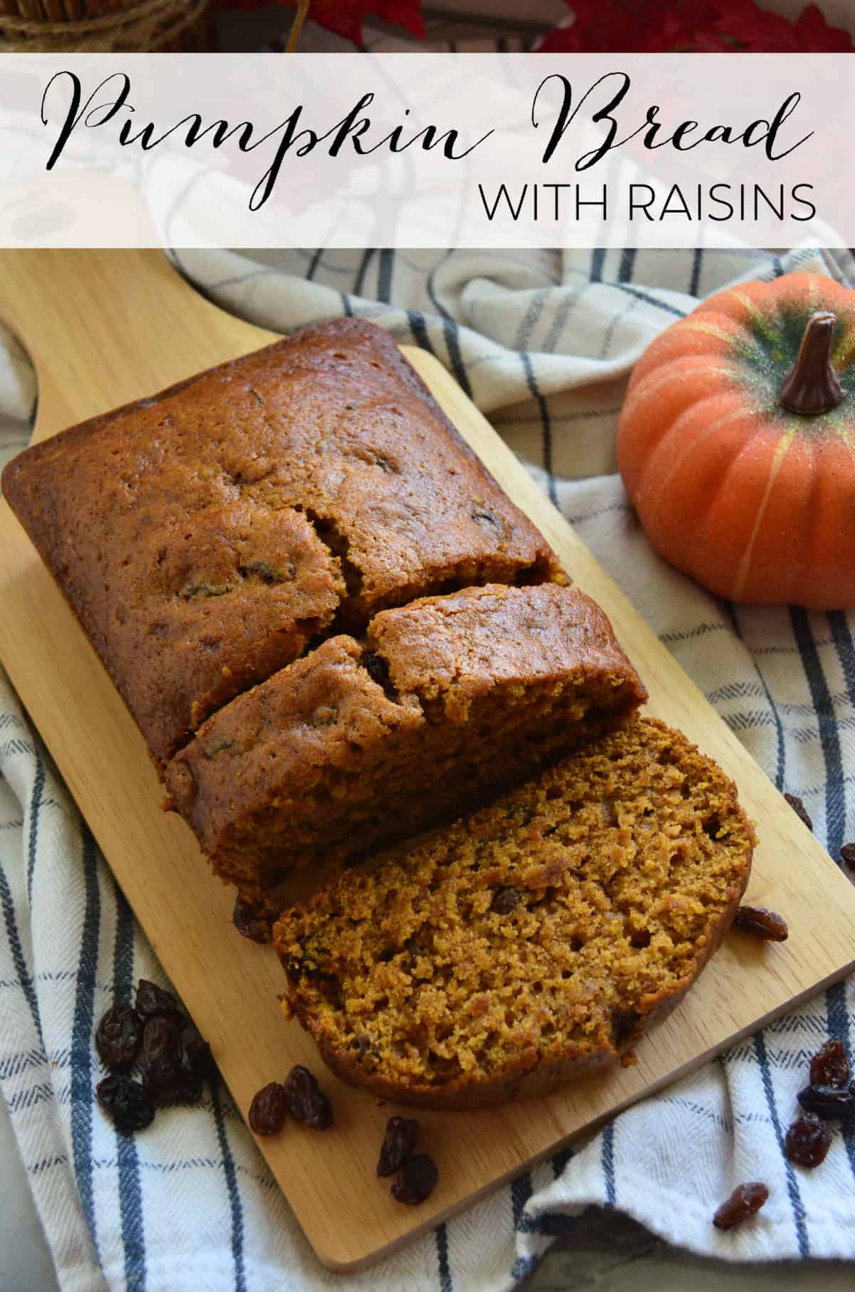 pumpkin bread with raisins on paddle with 2 pieces sliced next to pumpkin with title text.