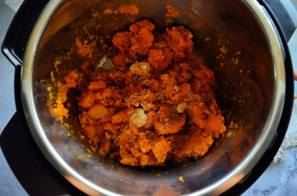 Top view of sweet potatoes and brown sugar in instant pot.