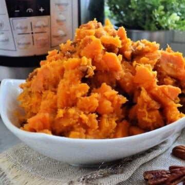 Close up of Bowl of Candied Sweet potatoes in front of Instant Pot.