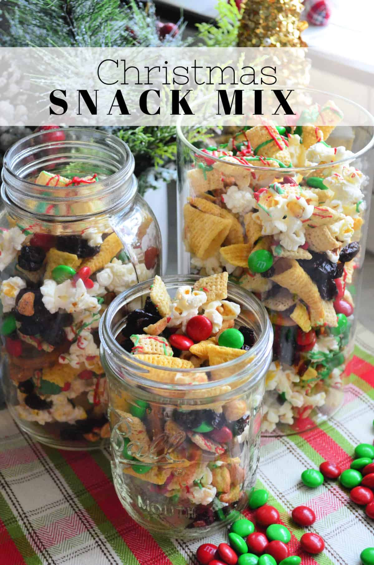 3 class containers of red and green chocolate drizzled check mix and popcorn with title text.