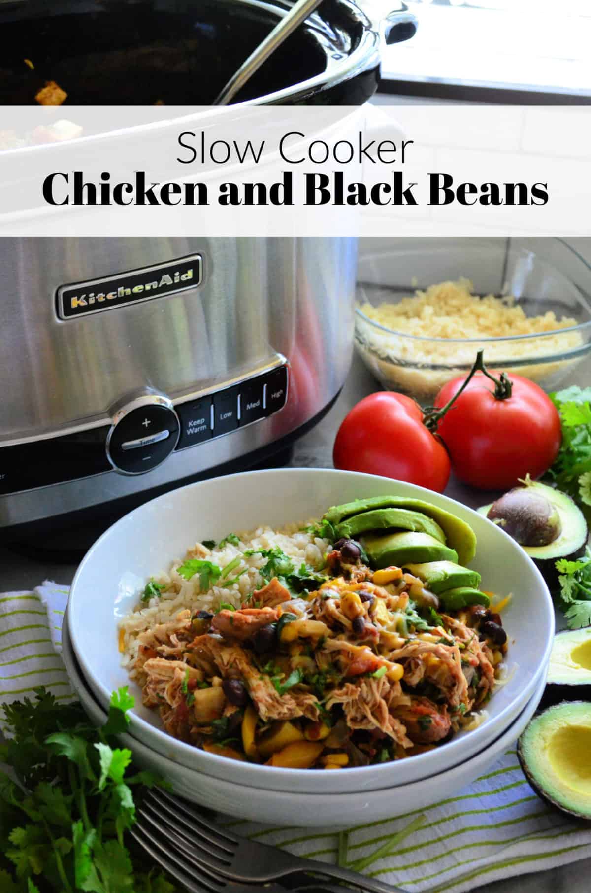 Two white bowls stacked with white rice, chicken, and veggies with slow cooker in background.