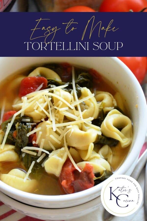 Top view of a white bowl filled with spinach, tomatoes, and tortellini soup with text on image for Pinterest.