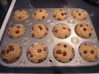 Top view of Banana Chocolate Chip Muffins in a muffin tin.