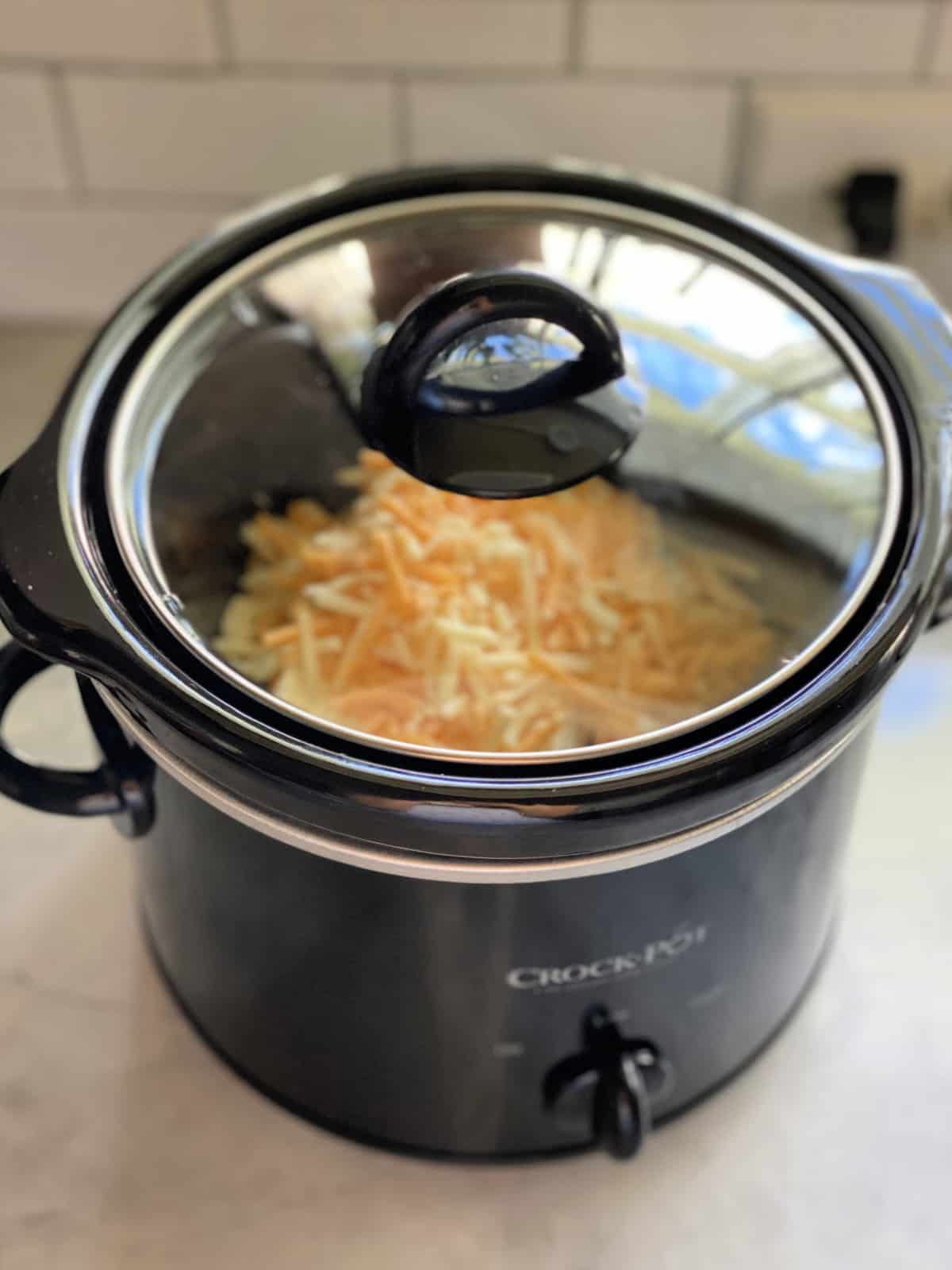 Top view of Chili Cheese Dip cooking in a mini Crock Pot.