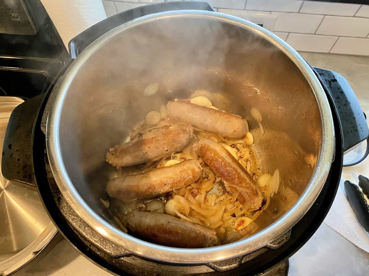 Caramelizing onions and garlic in the Instant Pot with Italian Sausage.