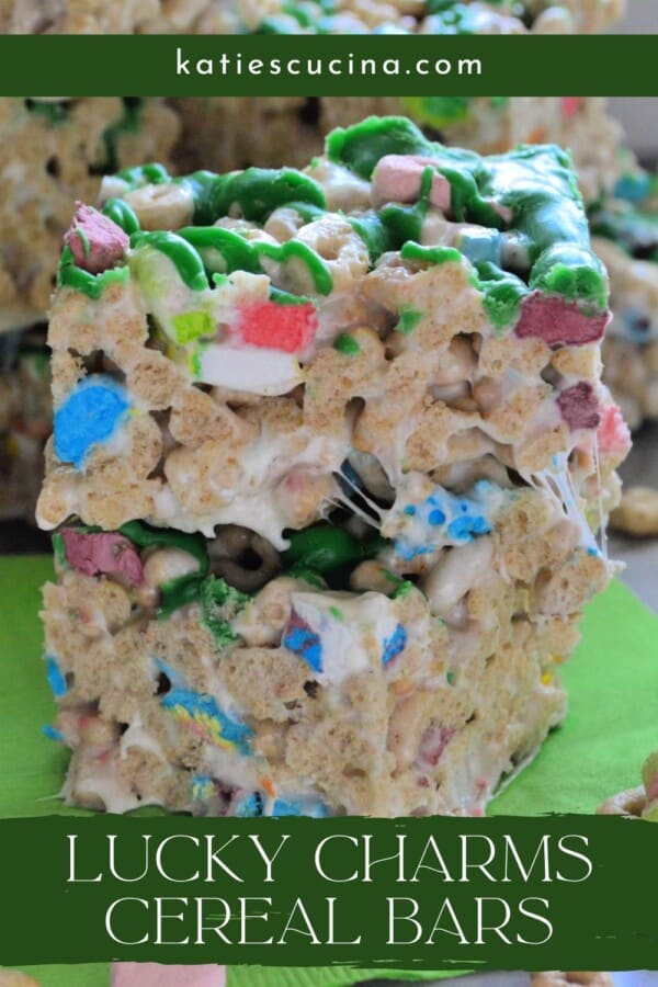 Two marshmallow cereal bars stacked with recipe title text on image for Pinterest.