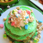Top view of vertical photo of decorated St. Patrick's Day Lucky Charms Pancakes.