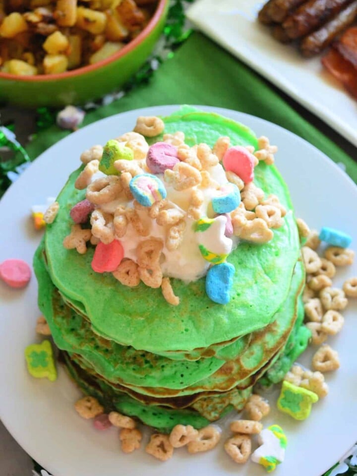 Top view of vertical photo of decorated St. Patrick's Day Lucky Charms Pancakes.