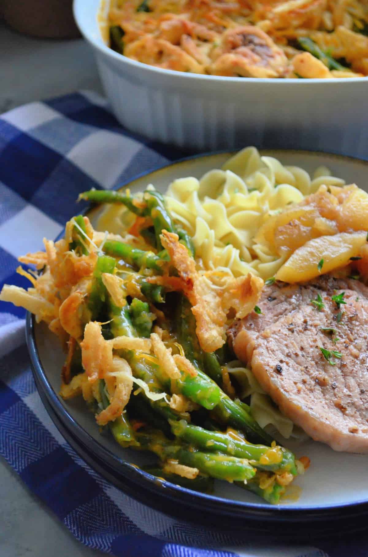 Cheesy Green Bean Casserole on a dinner plate.