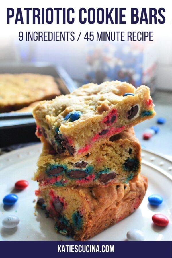 Stacked M&M cookie bars on a white plate with text for Pinterest.