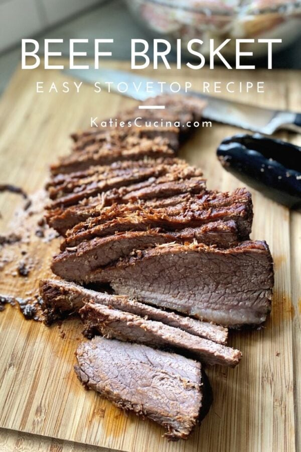 Pieces of sliced brisket on a wooden cutting board with text.