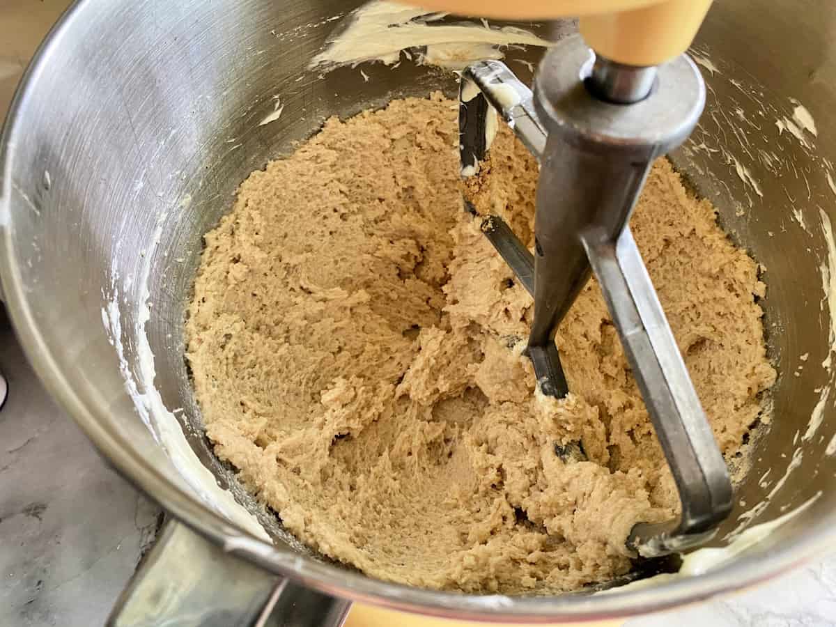 Creamed butter with white granulated sugar and brown sugar in a stand mixer.