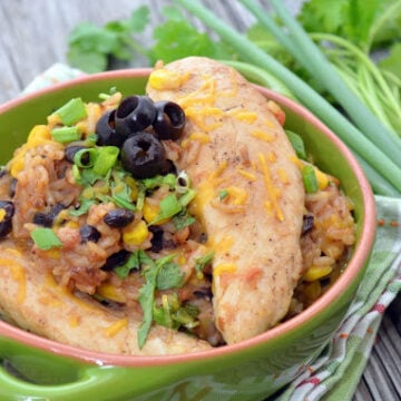 Bowl of Creamy Arroz con Pollo with title text for pinterest.
