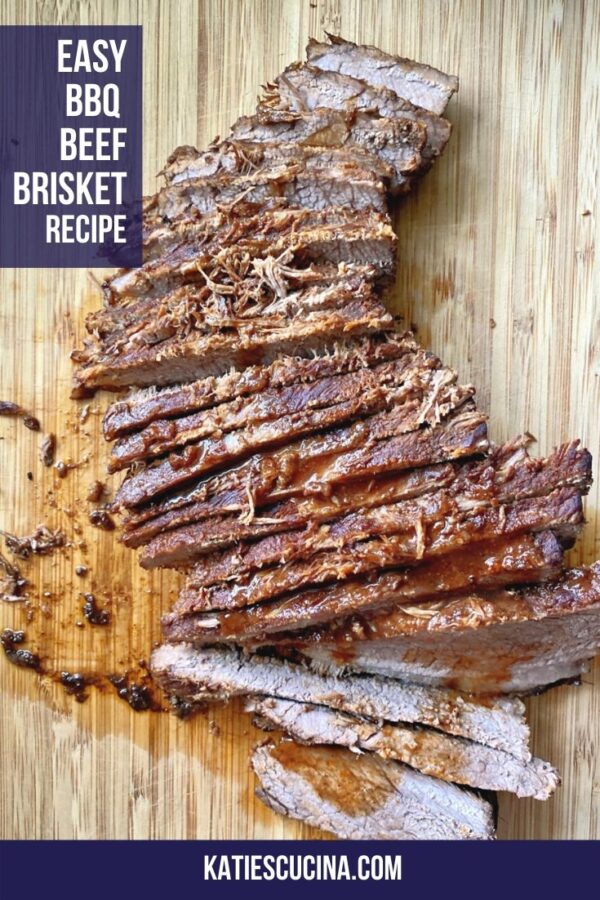 Top view of juicy peices of sliced beef on wood cutting board.