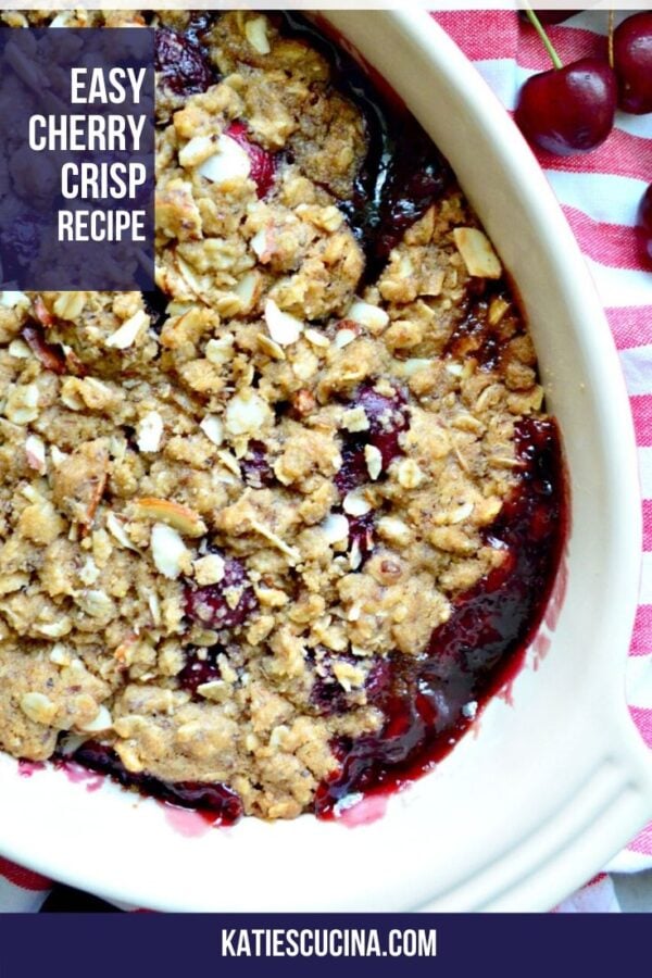 Top view of a cherry crisp with almonds with text on image for Pinterest.