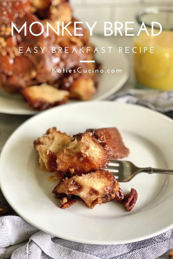 Pieces of sweet bread pulled apart on a white plate.