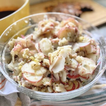 Glass bowl filled with potato salad.