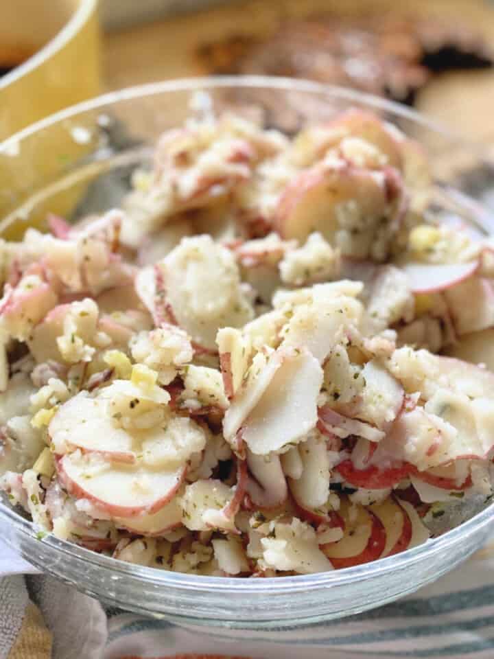 Glass bowl filled with potato salad.