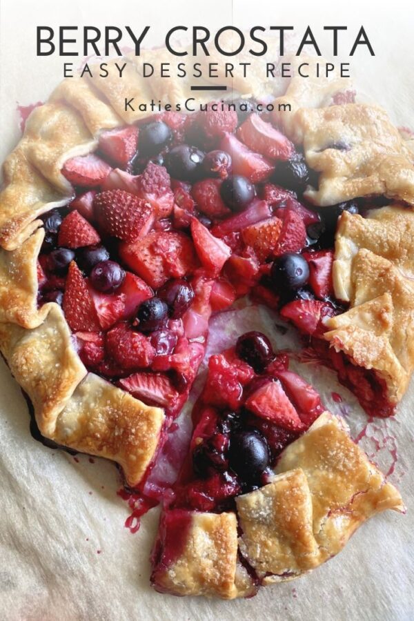 Top view of baked open pie with berries with text on image for Pinterest.