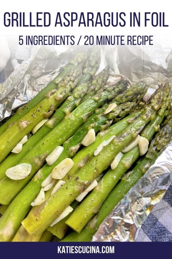 Side view of asparagus spears with garlic in tinfoil and text on image.