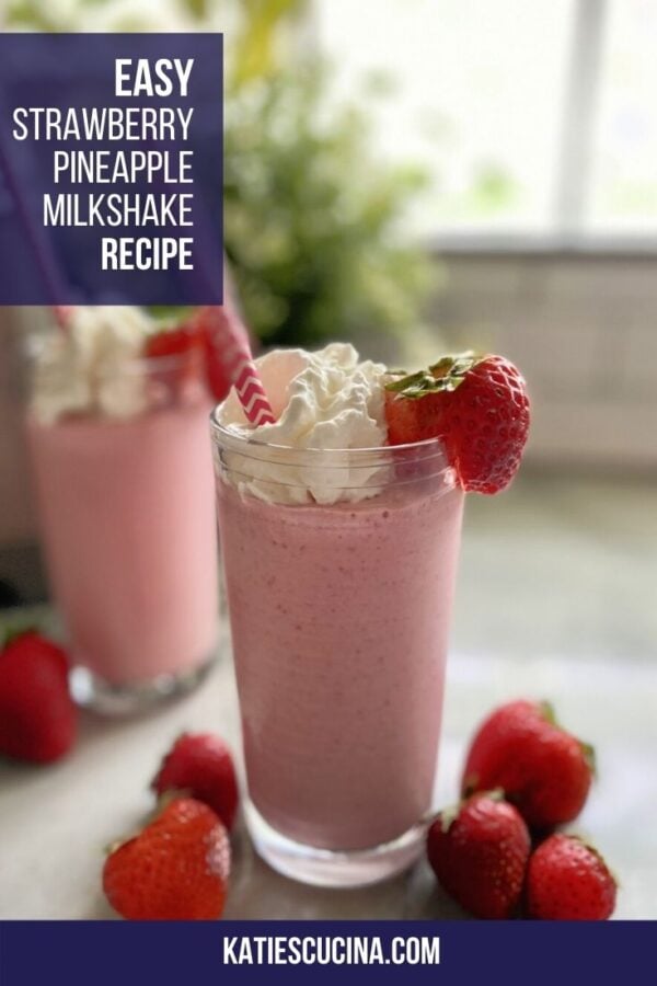 Close up of strawberry milkshakes with strawberries on counter and text.