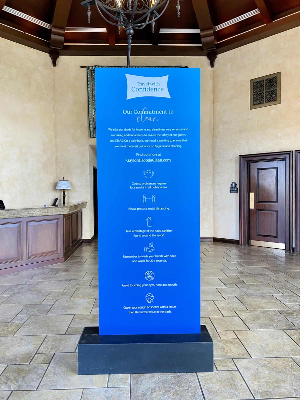 Travel with confidence blue sign in the atrium at the Gaylord Palms Resort.