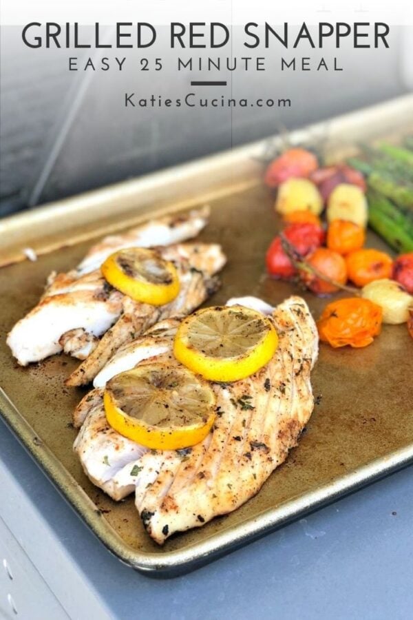 Gold baking sheet with cooked fish and veggies with text on image for Pinterest.