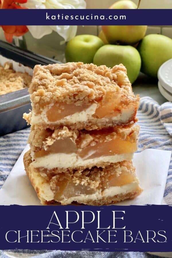 Three stacked apple cheesecake bars with crumb topping with text on image for Pinterest.