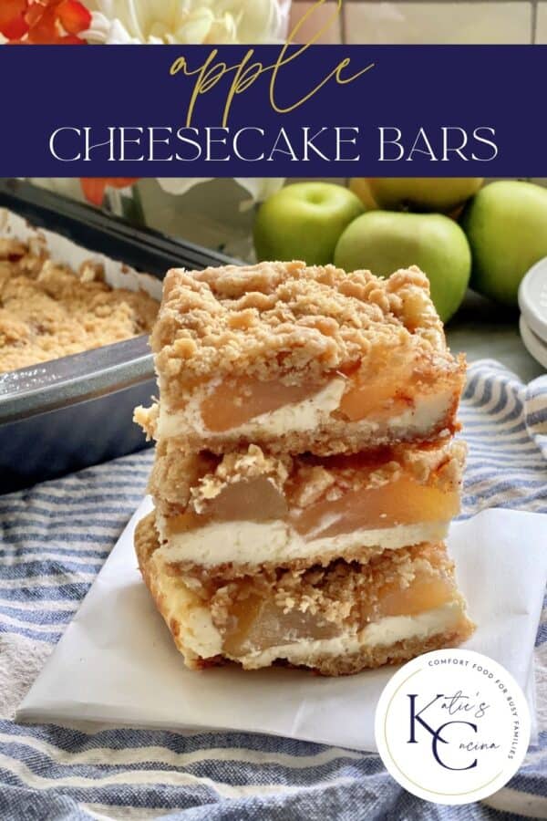 Three apple streusel cheesecake bars stacked on top of each other with text on image for Pinterest.