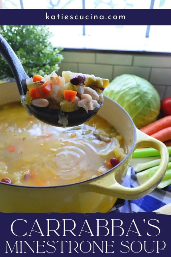 Black ladle full of minestrone soup over a yellow filled soup pot.