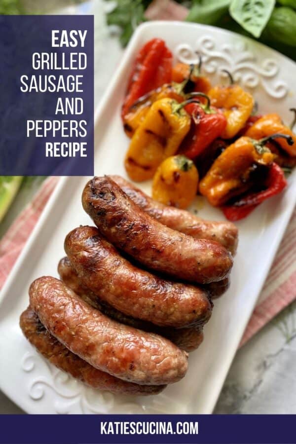 Top view of a white platter with grilled sausage and peppers with text on image for Pinterest.
