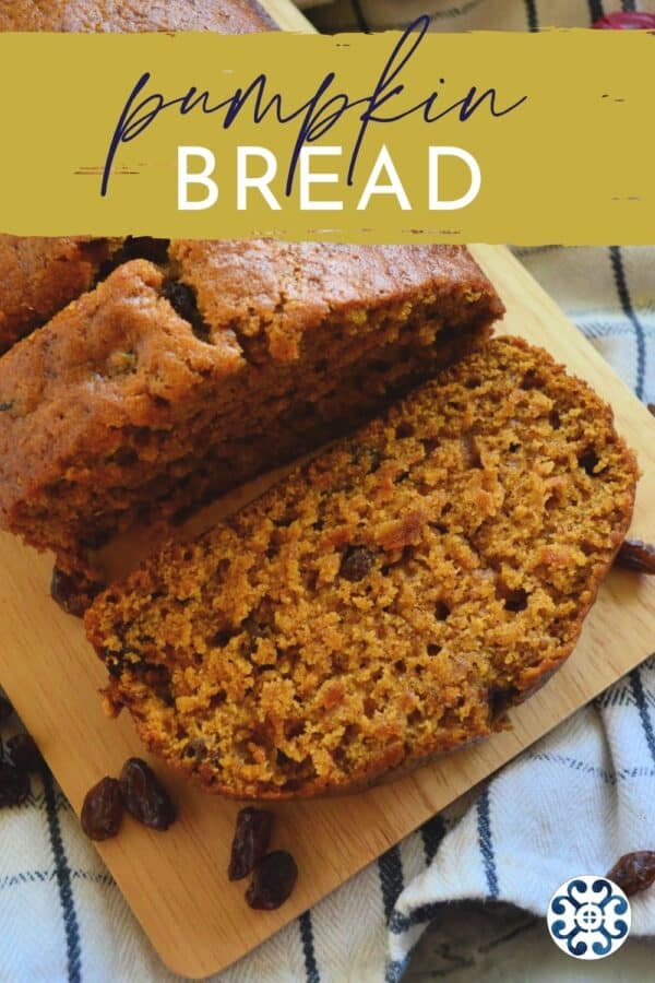 Two slices of pumpkin bread with raisins on a wood board with text on image.