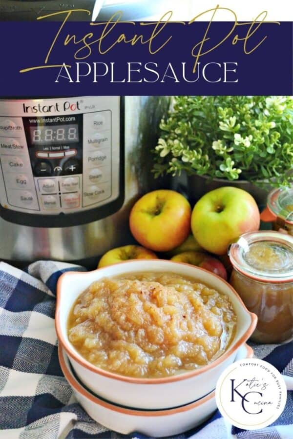 Applesauce in a white bowl with Instant Pot, apples, and jars in background.