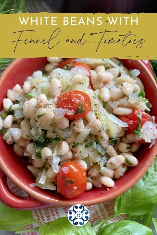 Top view of a red bowl filled with white beans and tomatoes with text on image for Pinterest.