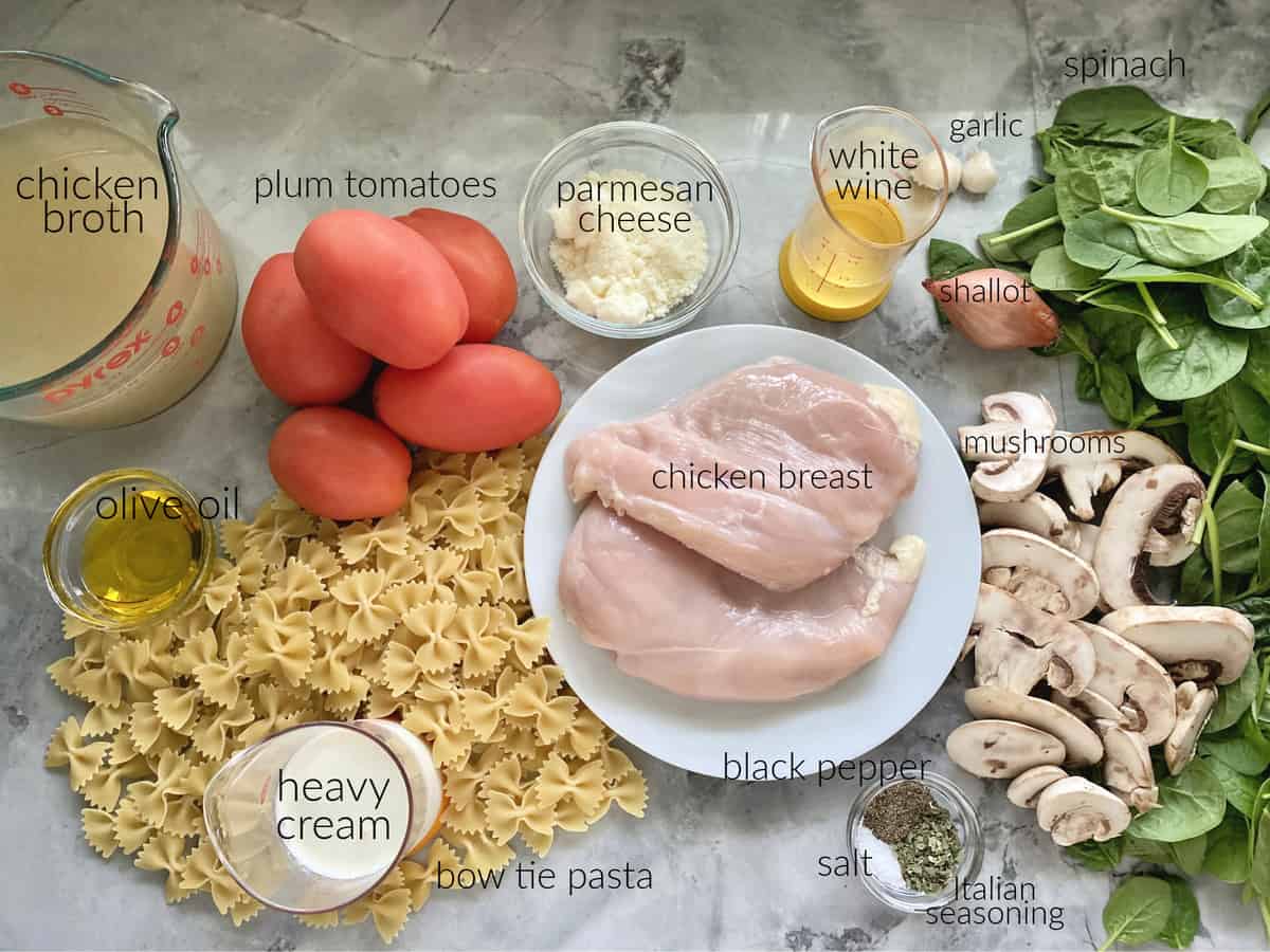 Ingredients: bow tie pasta, chicken breast, mushrooms, spinach, oil, tomatoes, cream.
