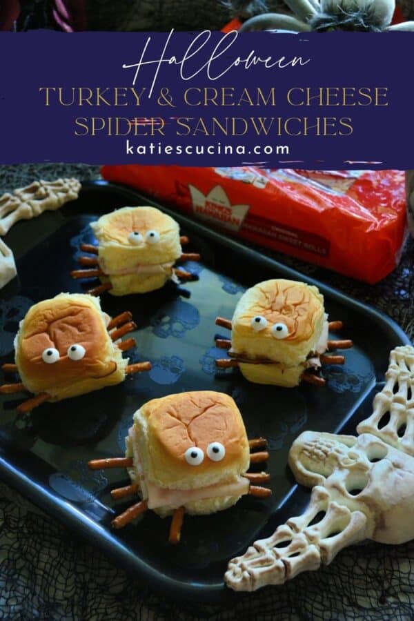 Four spider sandwiches on a black tray with text on image for Pinterest.