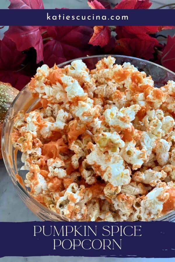 Top view of a bowl of orange popcorn with text on image for Pinterest.