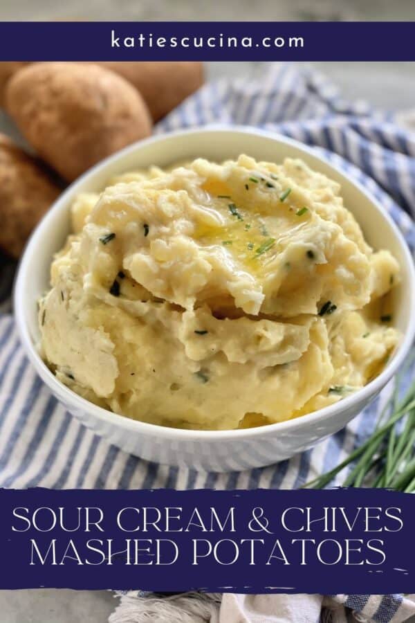 White bowl filled with mashed potatoes, butter, and chives with text on image.