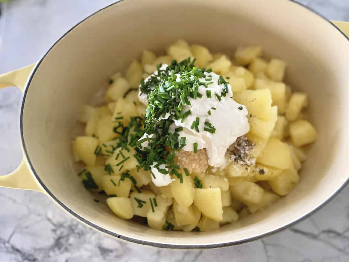 Cooked diced potatoes, sour cream, garlic, and chives.