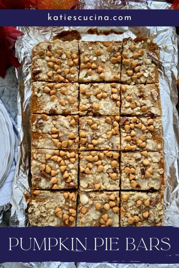 Sheet pan of Pumpkin Pie Bars cut into 15 squares with text on image for Pinterest.