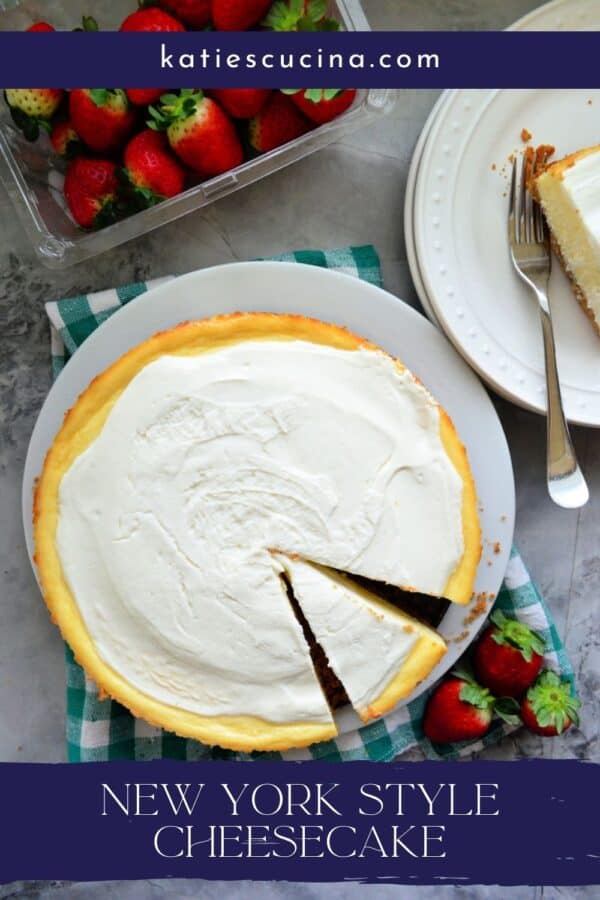 Top view of a whole cheesecake with a slice taken out and text on image for Pinterest.