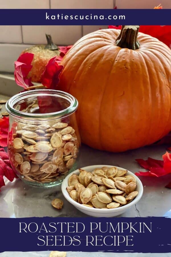 Dish with pumpkin seeds, jar filled, and pumpkin in background.