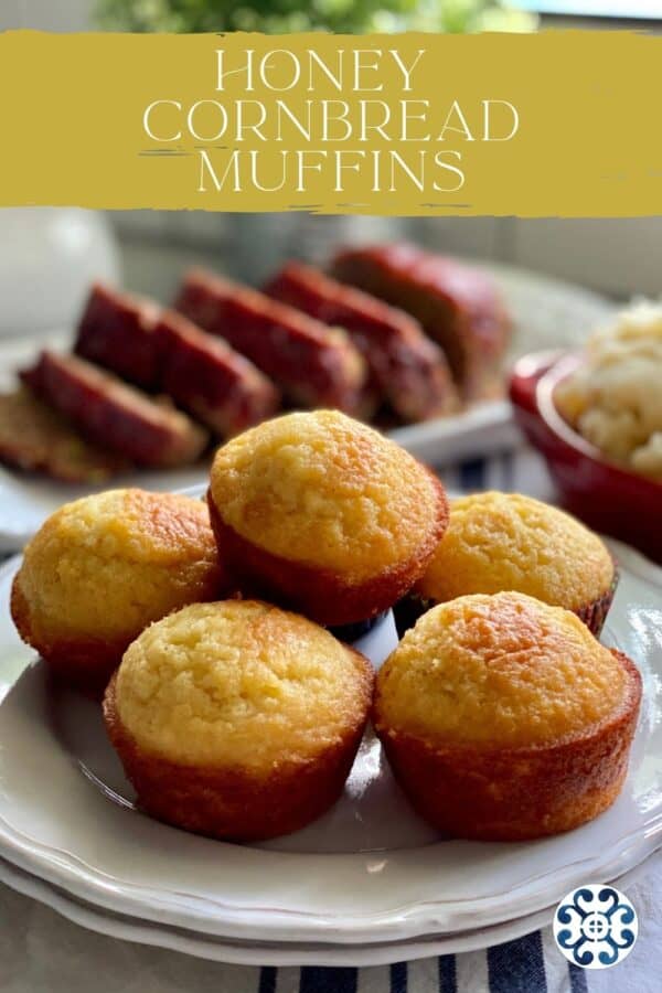 Six cornbread muffins stacked on a white plate with text on image for Pinterest.