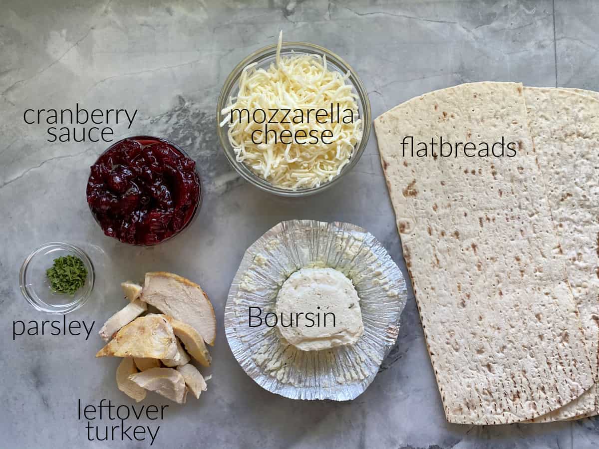 Ingredients: flatbreads, mozzarella, cranberry sauce, Boursin cheese, turkey, parsley.