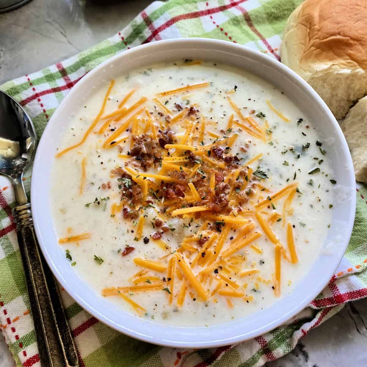 white bowl filled with mashed potato soup.