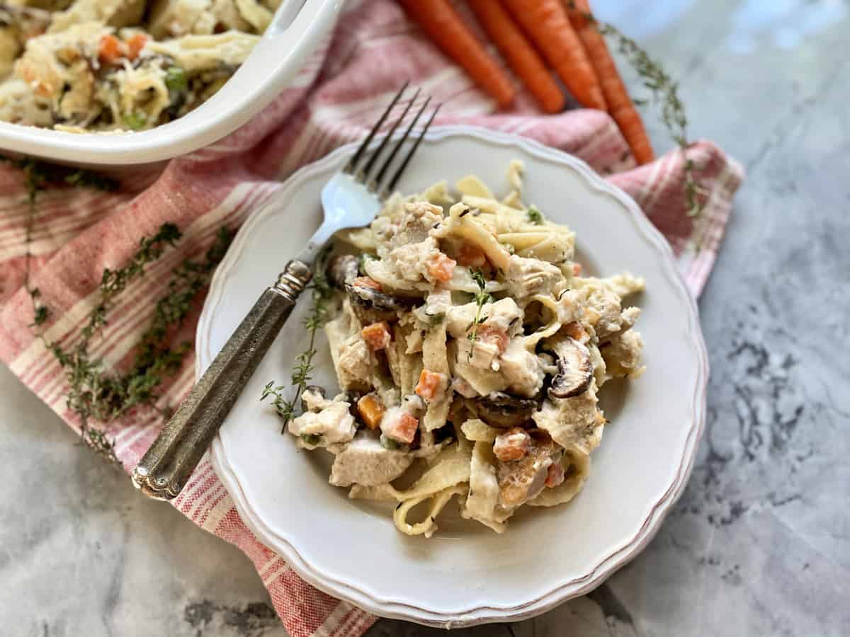 Top view of a plate of turkey tetrazzini with a fork on the plate.