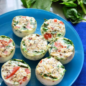 Close up of a blue plate filled with egg white bites